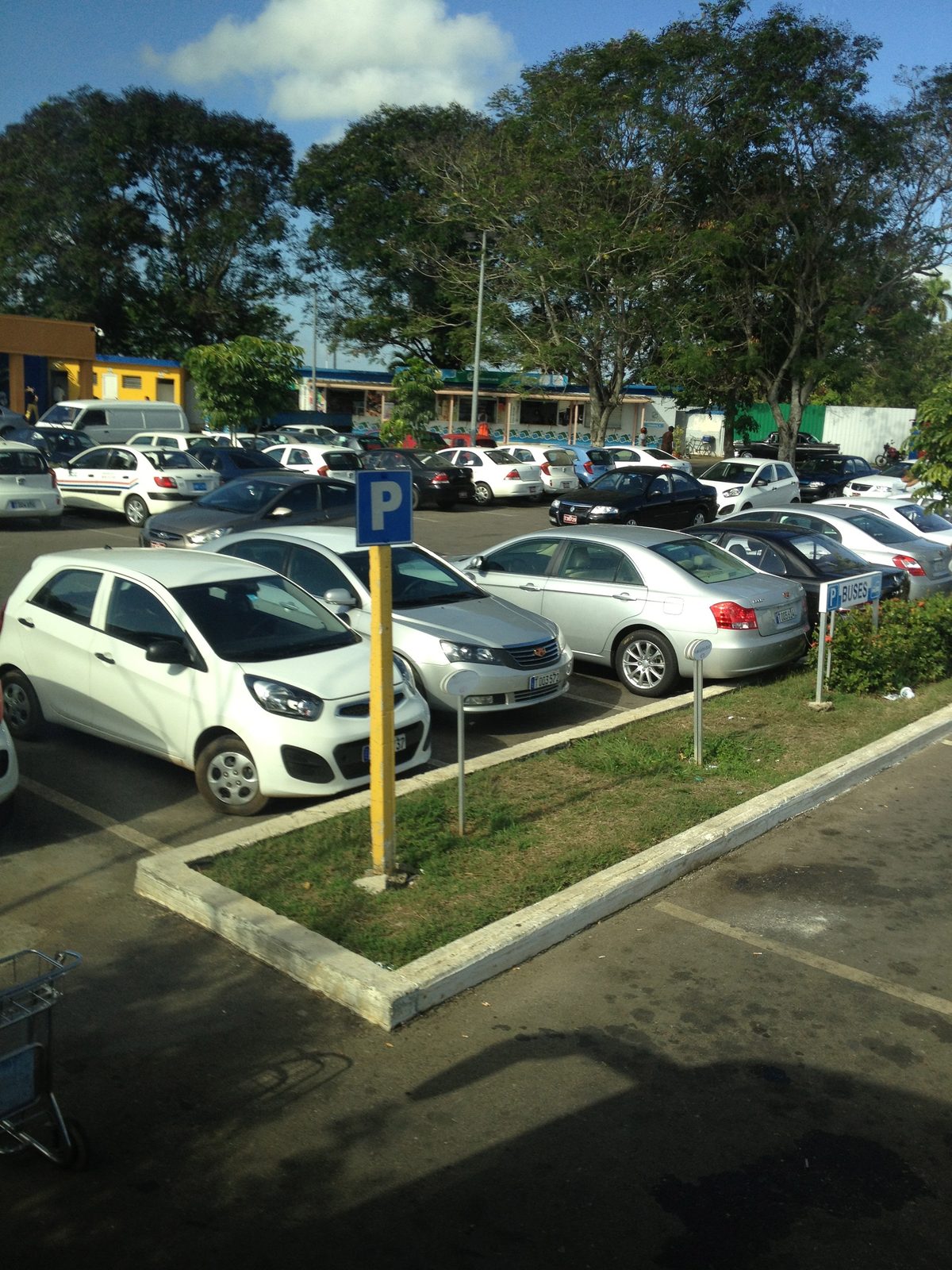 Parking lot at Havana airport.  Airport much smaller than a city of this stature - two million...